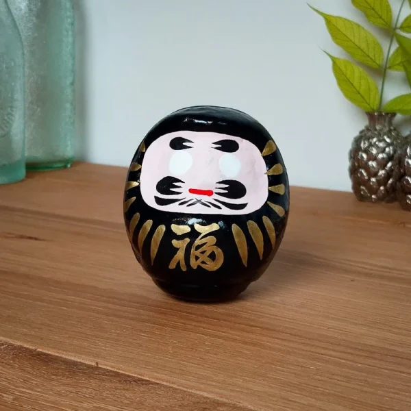 daruma japonés negro